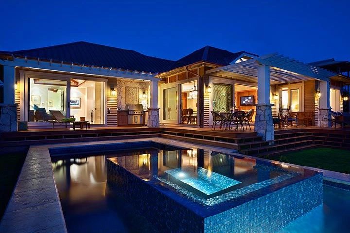 Luxury modern home with pool at twilight